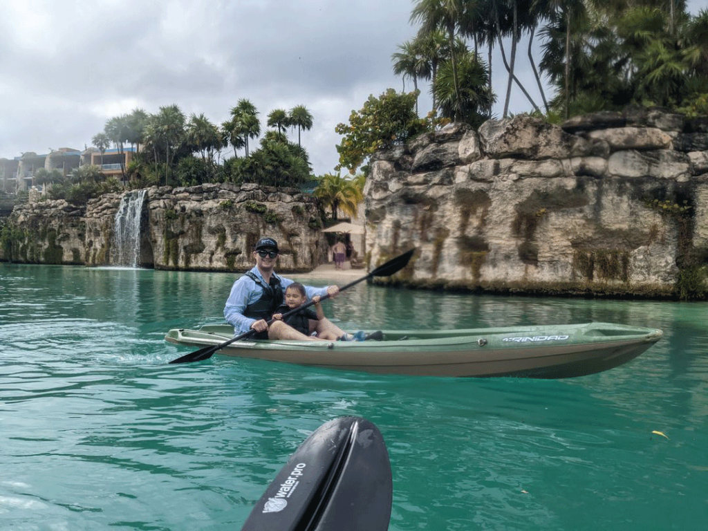 Dr. Morton Baker with his son kayaking